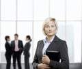 Confident businesswoman in office lobby