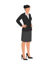 Confident businesswoman posing with arms akimbo Royalty Free Stock Photo