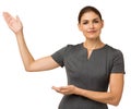 Confident Businesswoman Showing An Imaginary Product