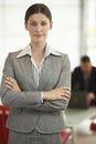 Confident Businesswoman Standing Arms Crossed In Office Royalty Free Stock Photo