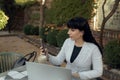 Confident businesswoman wearing casual clothes and using a laptop while working online. Online work concept Royalty Free Stock Photo