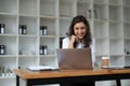 Confident businesswoman working on laptop at her workplace at modern office. Royalty Free Stock Photo