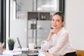 Confident businesswoman working on laptop at her workplace at modern office. Royalty Free Stock Photo