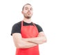 Confident butcher posing with folded arms