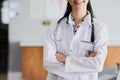 Confident and capable. an unrecognizable female doctor standing with her arms folded in a hospital. Royalty Free Stock Photo