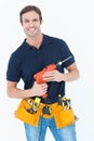 Confident carpenter holding portable drill machine Royalty Free Stock Photo