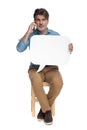 Confident casual man talking on phone and holding speech bubble Royalty Free Stock Photo