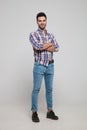 Confident casual man wearing a shirt with checkers standing Royalty Free Stock Photo