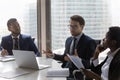 Confident Caucasian businessman, team leader speaking at corporate meeting Royalty Free Stock Photo