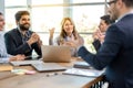 Confident CEO businesswoman team leader speaking and explaining future company tasks and plans with business colleagues. Royalty Free Stock Photo