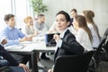 Confident CEO smiling to camera at meeting Royalty Free Stock Photo