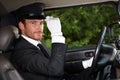 Confident chauffeur in elegant automobile Royalty Free Stock Photo