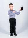 Confident child has business start up. Modern life. small boy with mobile phone. little boss. Ceo direstor. Office life Royalty Free Stock Photo