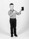 confident child has business start up. Modern life. small boy with mobile phone. little boss. Ceo direstor. Office life Royalty Free Stock Photo