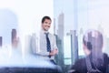 Confident company leader on business meeting against new york city manhattan buildings and skyscrapers window reflection Royalty Free Stock Photo