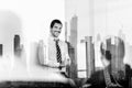 Confident company leader on business meeting against new york city manhattan buildings and skyscrapers window reflection Royalty Free Stock Photo