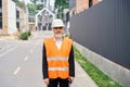 Confident construction superintendent with walkie-talkie posing outdoors Royalty Free Stock Photo