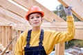 confident constructor engineer female in New residential construction home framing