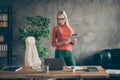 Confident cool man true leader hold tablet look into computer read modern startup information stand wearing red