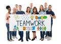 People Holding Banner Of Teamwork Concept Royalty Free Stock Photo