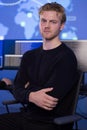 Confident cybersecurity professional in a modern SOC environment with a global map Royalty Free Stock Photo