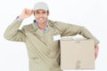 Confident delivery man carrying cardboard box Royalty Free Stock Photo