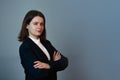 Confident and determined businesswoman with crossed arms looking to camera. Personal development and motivation concept Royalty Free Stock Photo