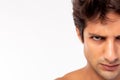 Confident, determined handsome young guy. Handsome young Caucasian man looks at camera. Male get angry, mad face. Closeup half Royalty Free Stock Photo