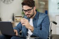 confident disabled using laptop at desk Royalty Free Stock Photo