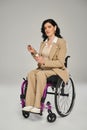 confident disabled woman in pastel suit