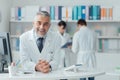 Confident doctor at the reception desk