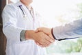 Confident Doctor shaking hands with patients talk in the hospit Royalty Free Stock Photo