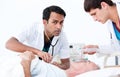 Confident doctors resuscitating a patient Royalty Free Stock Photo