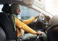 Confident Driver. Smiling African Muslim Woman In Headscarf Driving Modern Car Royalty Free Stock Photo