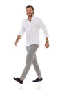 Confident Elegant Man Is Walking, Looking At Camera And Smiling Royalty Free Stock Photo