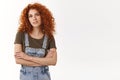 Confident empowered good-looking redhead curly-haired girl, cross arms and smiling self-assured at camera, know her work