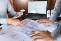 Confident engineer team working with Blue Print with architect equipment discussing and Planning work flow construction project. w Royalty Free Stock Photo