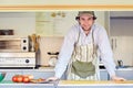 Confident entrepeneur in his takeaway food stall Royalty Free Stock Photo