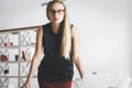 Confident european woman leaning on desk