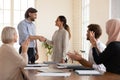 Confident executive shaking successful businesswoman hand at meeting Royalty Free Stock Photo