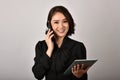 Confident expert woman secretary smiling and working at office. Royalty Free Stock Photo