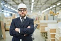 Confident factory investor in hardhat