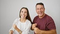 Confident father and daughter sharing a joyful dance, smiling on white isolated background, displaying a happy hispanic family Royalty Free Stock Photo