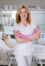 Professional Aesthetician in Clinic with Client in Background Royalty Free Stock Photo