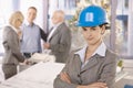 Confident female architect wearing hardhat Royalty Free Stock Photo