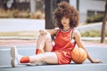 Confident female basketball coach with ball outside. Womens fitness motivation, workout, sports training and exercise