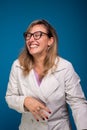 Confident female doctor dressed in beige coat, wearing glasses and smiling. Positive person Royalty Free Stock Photo