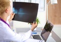 Confident female doctor examining accurately a rib Royalty Free Stock Photo