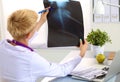 Confident female doctor examining accurately a rib Royalty Free Stock Photo