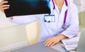 Confident female doctor examining accurately a rib Royalty Free Stock Photo